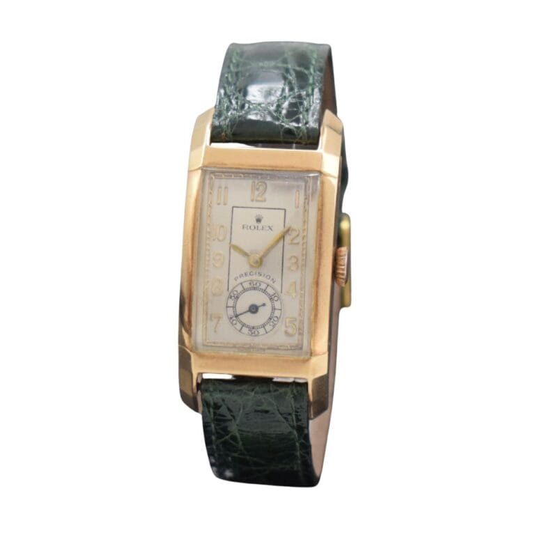 Vintage rectangular Rolex Prince watch with a gold case and dark green leather strap, showing the time as 11:59.
