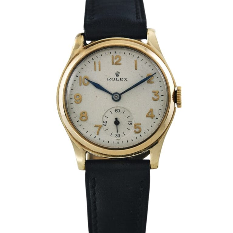 Gold Rolex wristwatch with a white dial, blue hands, black leather strap, and Arabic numeral hour markers.