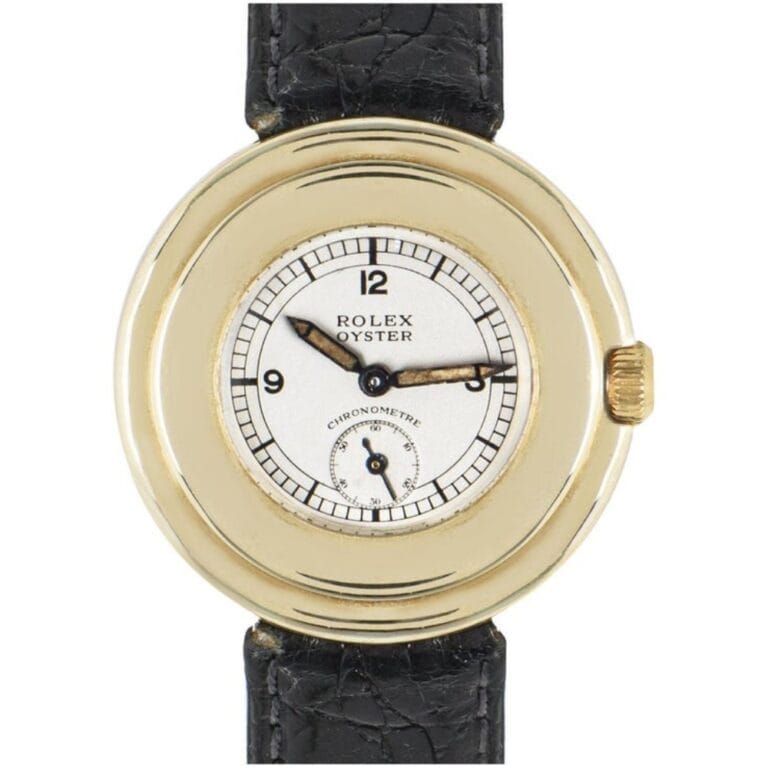 Gold Rolex Oyster watch, model 2849, features a white dial with black numbers and a sleek black leather strap.