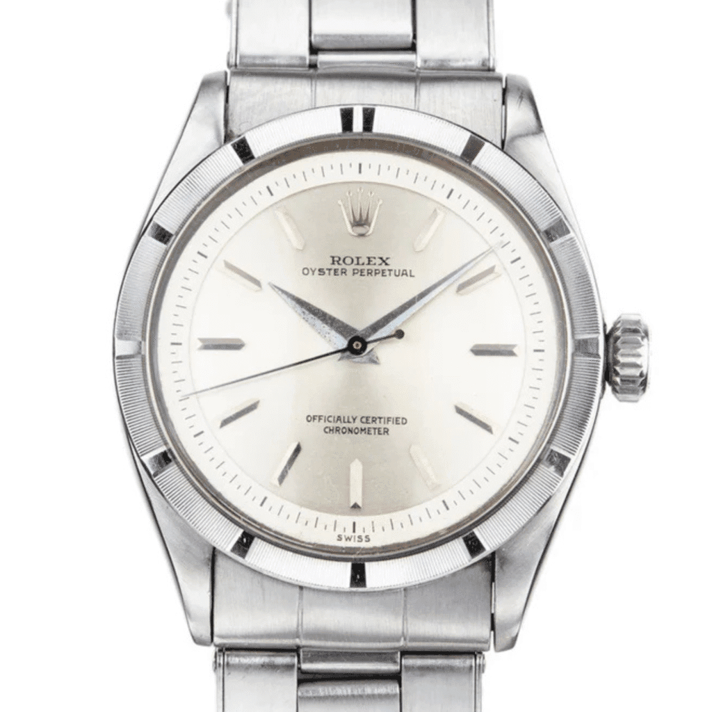 Silver Rolex Oyster Perpetual 6303 wristwatch with a white dial and silver hour markers on a metal bracelet.