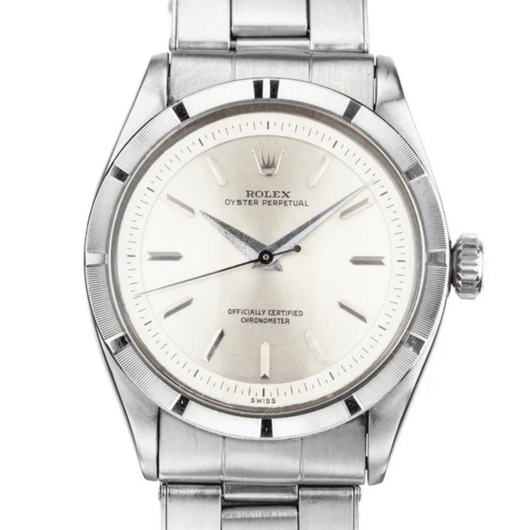 Silver Rolex Oyster Perpetual 6303 wristwatch with a white dial and silver hour markers on a metal bracelet.
