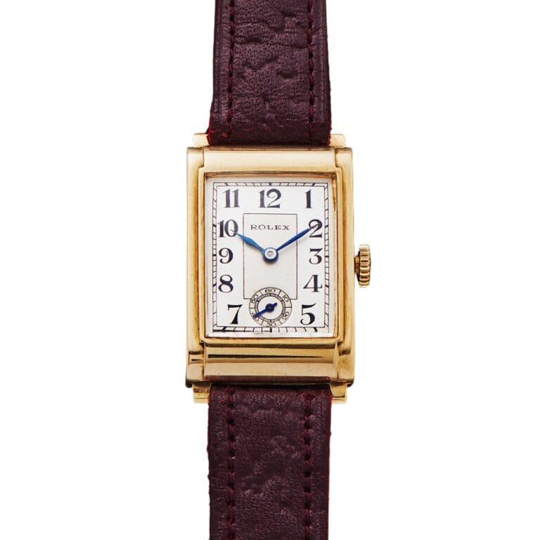 Rectangular gold Rolex wristwatch with a white dial, blue hands, and a brown leather strap.
