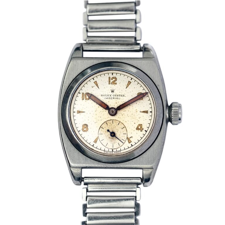 Vintage Rolex Oyster Imperial wristwatch with a cream dial, subdial, and metal link bracelet—classic style from the renowned Rolex Oyster collection.