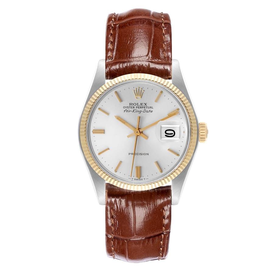 A Rolex 5701 wristwatch with a brown leather strap, white dial, gold bezel, and date display.