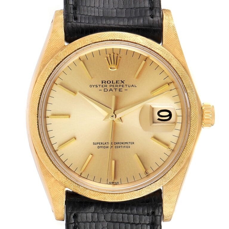 Gold Rolex Oyster Perpetual Date 1502 watch with a black leather strap, gold dial, and date window showing the number 9.