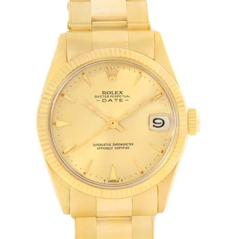 Gold Rolex Oyster Perpetual Date 6627 watch featuring a gold dial, gold bracelet, and a distinctive date window displaying the number 9.