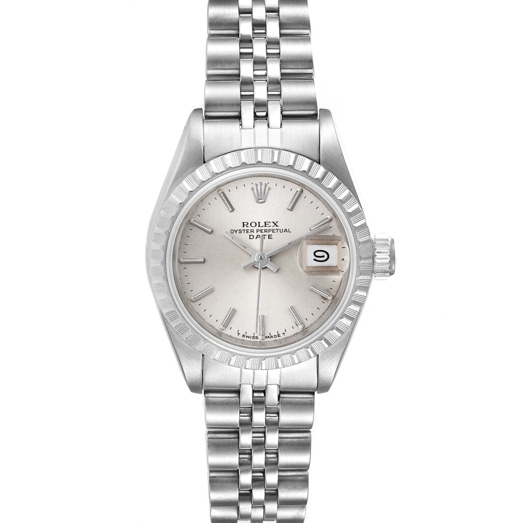 A silver Rolex Oyster Perpetual wristwatch with a metal band, white dial, and date display at the 3 o’clock position; model Date 69240.