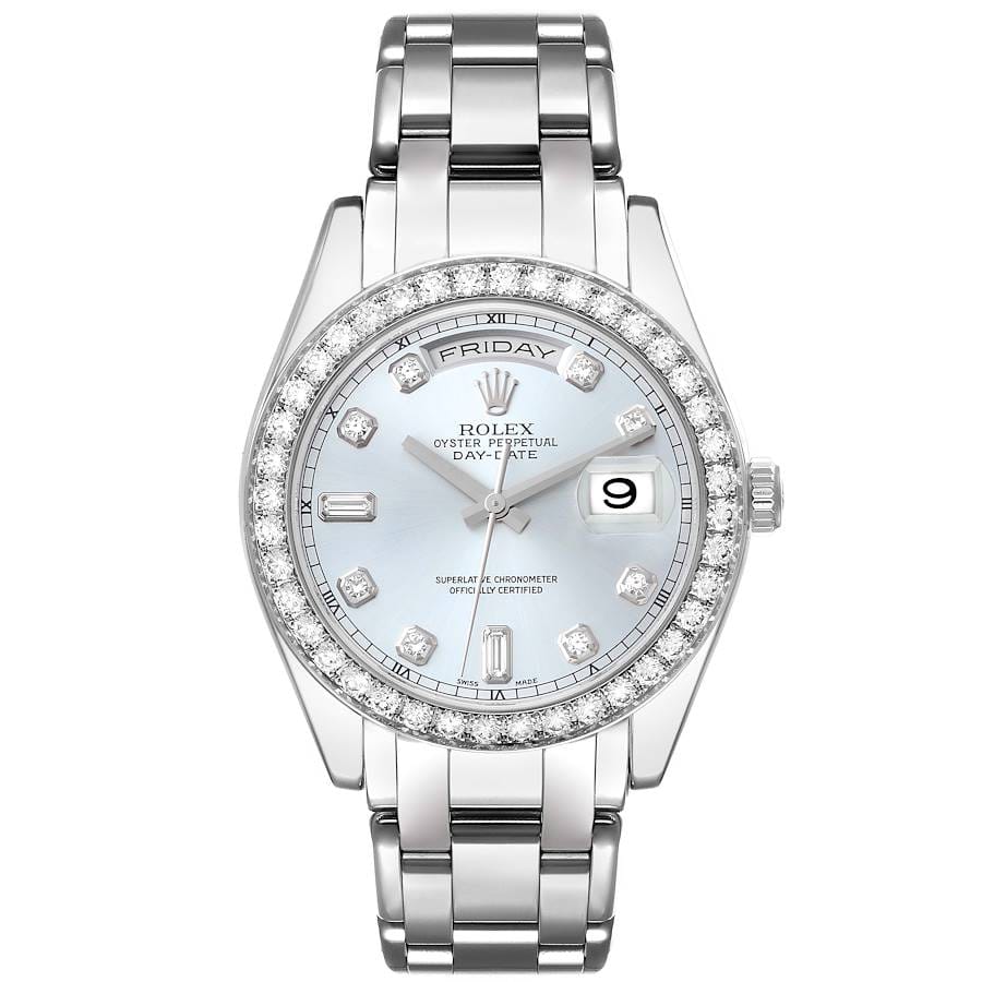 Silver Rolex Day-Date wristwatch with a diamond bezel, light blue face, and date display at three o’clock.