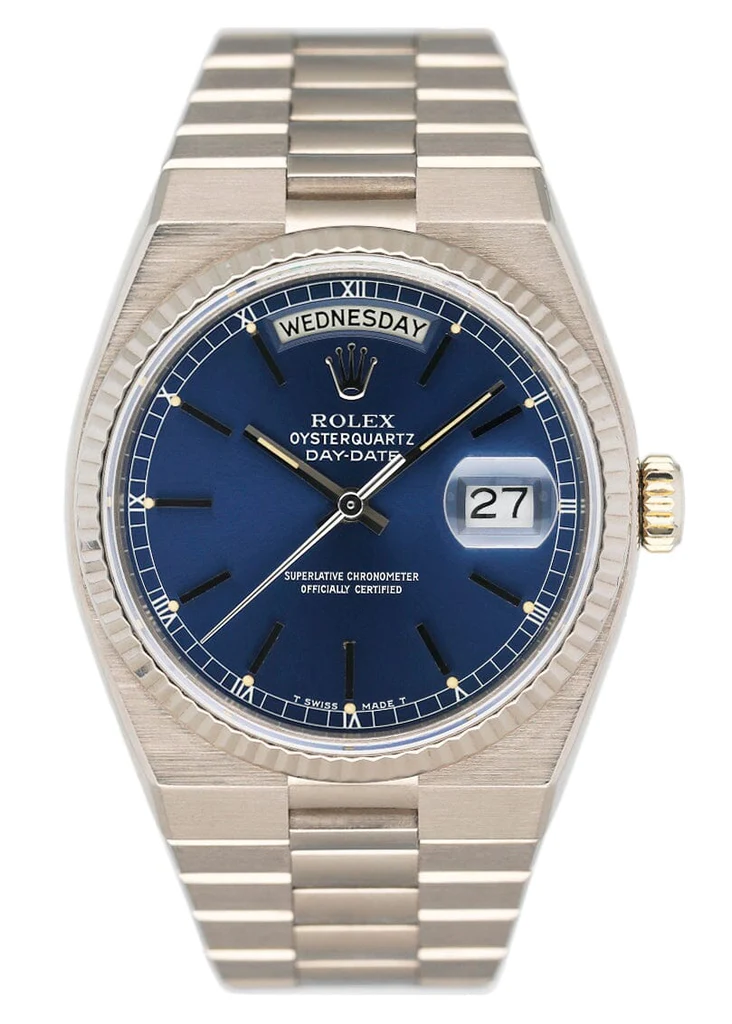 A silver Rolex Oysterquartz 19019 Day-Date watch with a striking blue dial displaying the day and date.