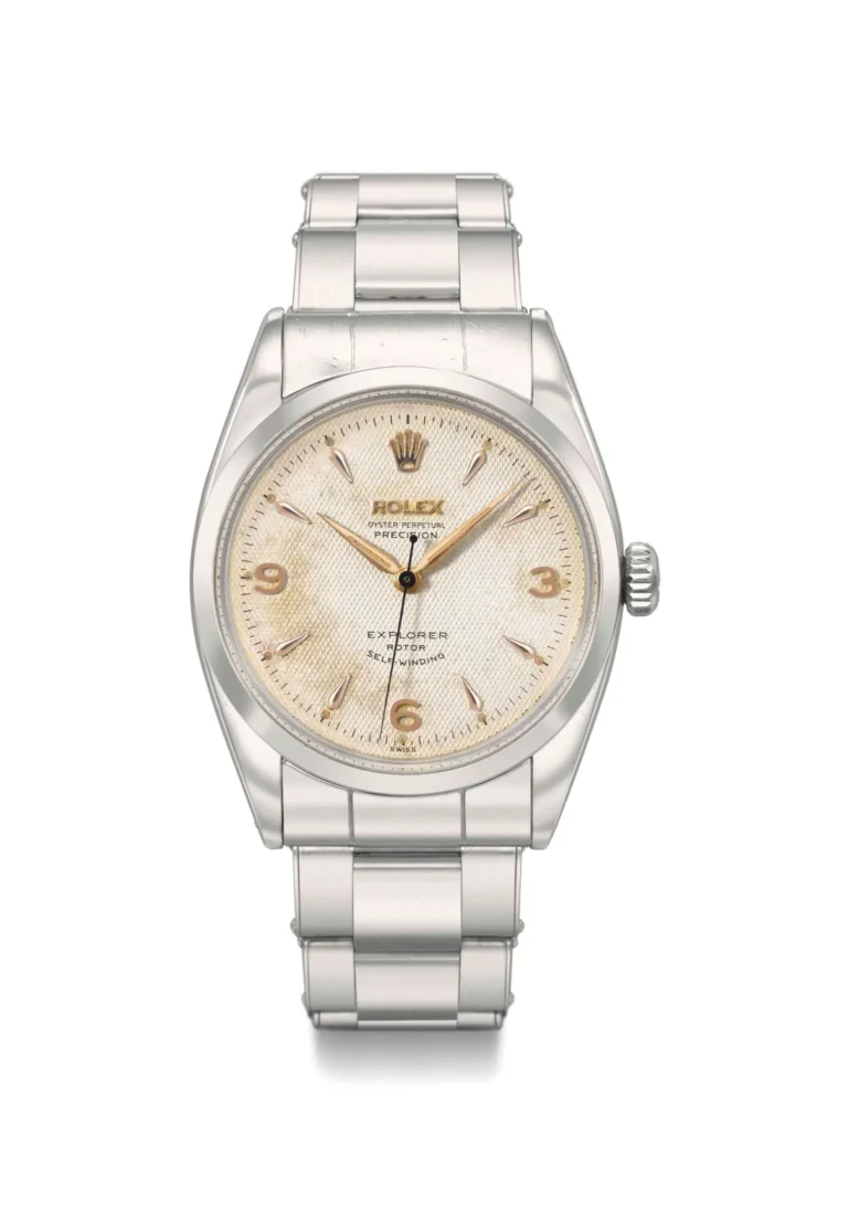 A vintage silver Rolex Explorer 6150 watch with a cream dial and silver hour markers on a metal bracelet.
