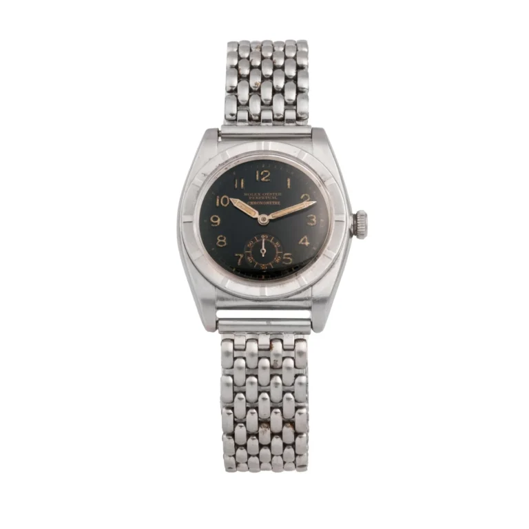 A vintage Rolex Oyster Perpetual 3172 silver wristwatch with a black dial and metal link bracelet is shown on a white background.