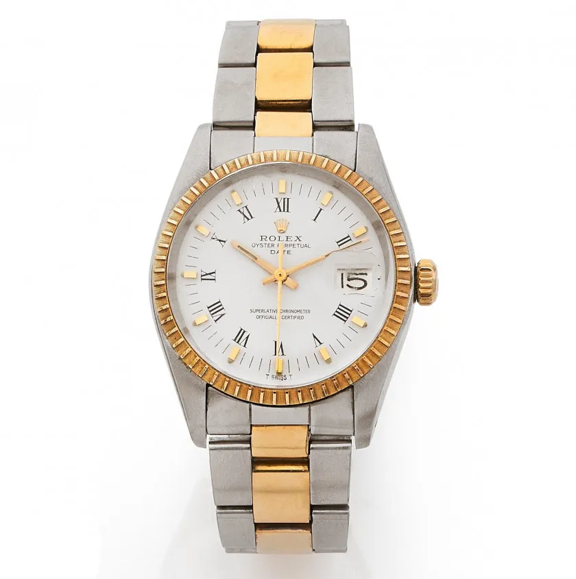 A two-tone Rolex Oyster Perpetual Date 1505 wristwatch with a white dial, gold bezel, and silver and gold metal bracelet.