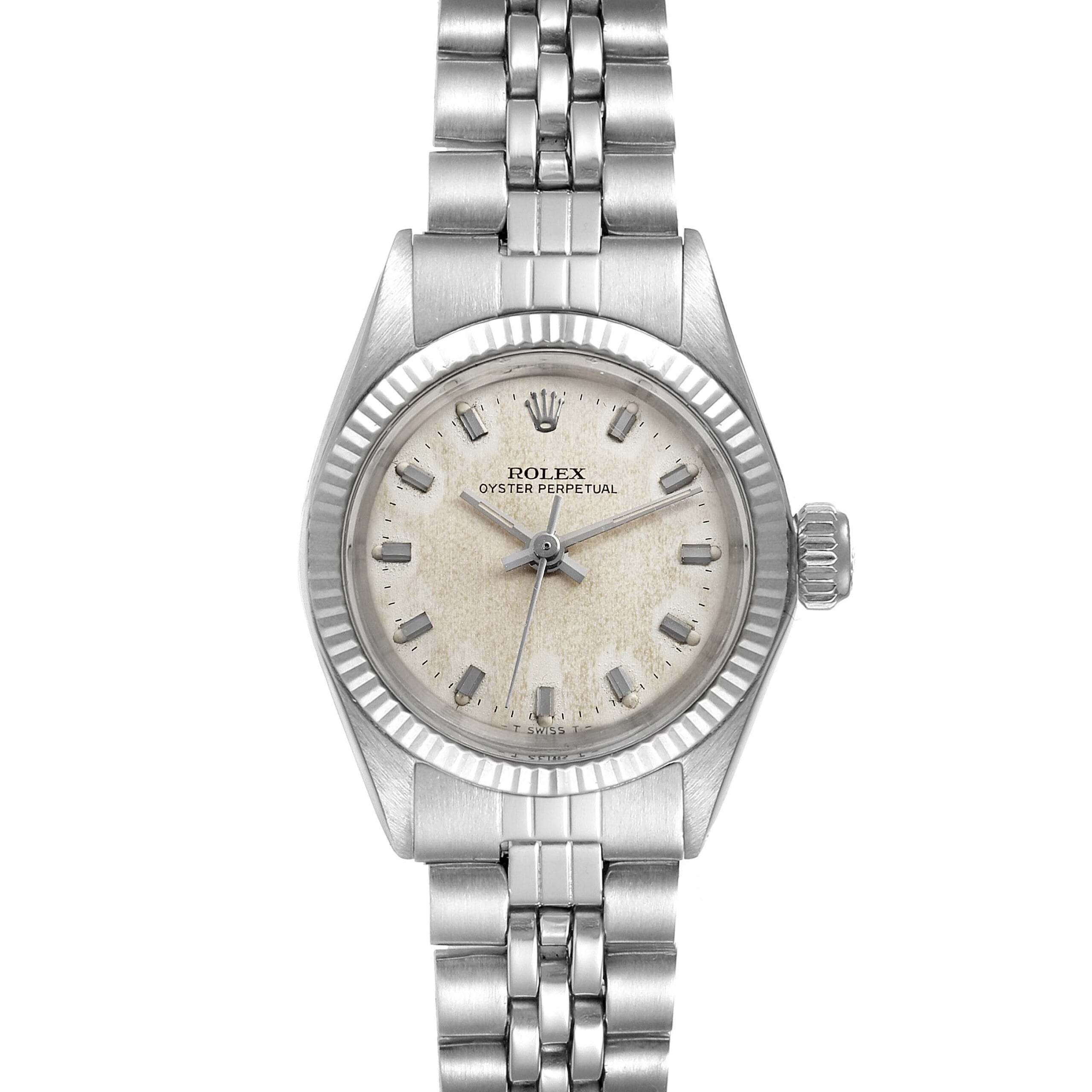 Silver Rolex Oyster Perpetual 6619 watch with a round, aged white dial and metal link bracelet, shown face up.