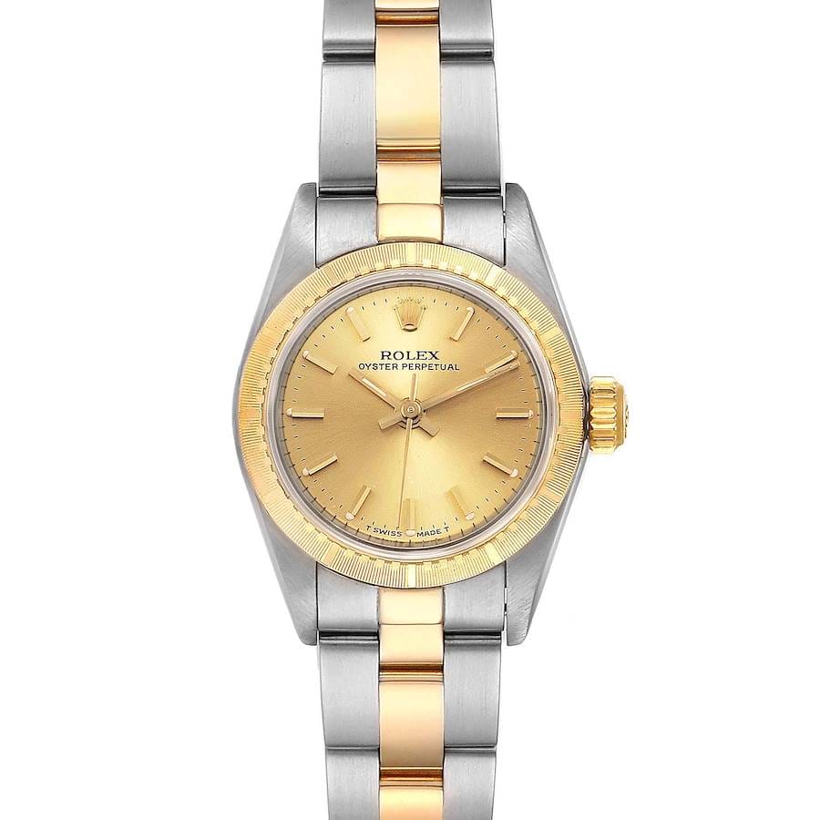 A striking Rolex Oyster Perpetual 67243 watch featuring a gold dial and a two-tone silver and gold bracelet, perfect for timeless elegance.