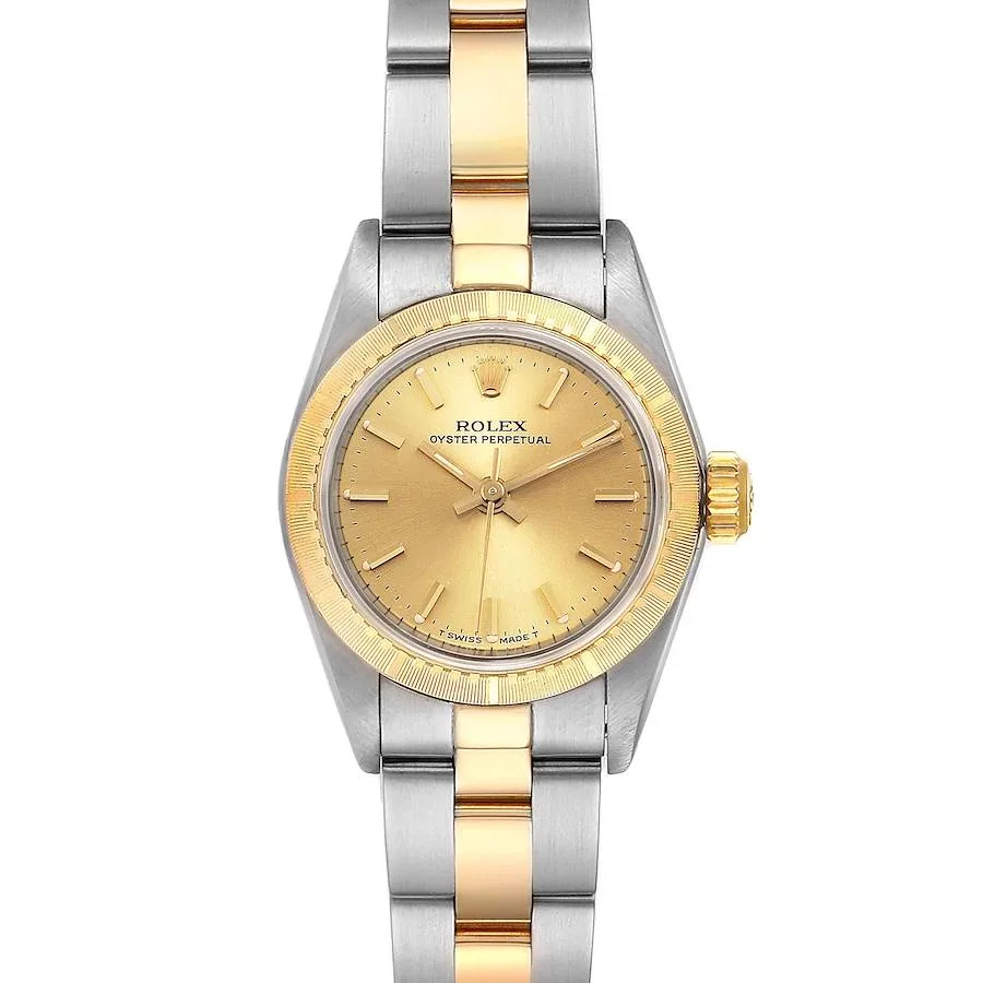 A striking Rolex Oyster Perpetual 67243 watch featuring a gold dial and a two-tone silver and gold bracelet, perfect for timeless elegance.