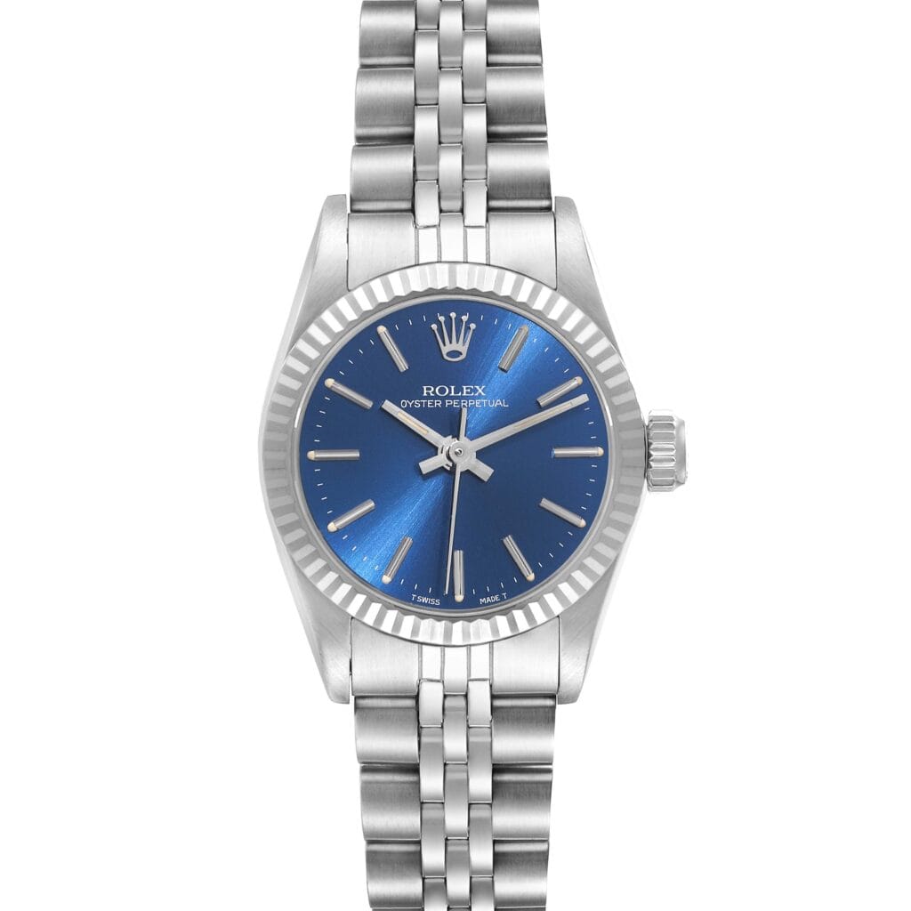 Silver Rolex Oyster Perpetual watch, model 67194, featuring a blue dial, metal strap, and silver hour markers, displayed on a white background.