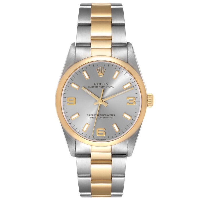 Rolex Oyster Perpetual 14203 watch with a silver and gold band, silver dial, and gold hour markers and hands.