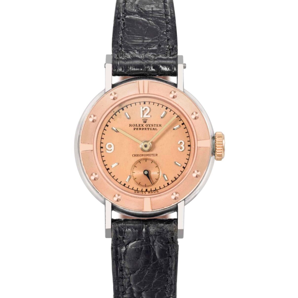 A vintage Rolex Oyster Perpetual wristwatch featuring a pink dial, black leather strap, and silver case.