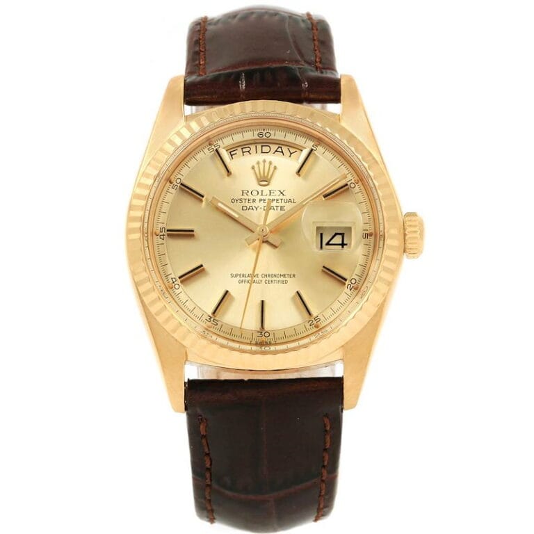 Gold Rolex Day-Date (President 1804) watch with a brown leather strap, displaying the day and date on a cream dial.