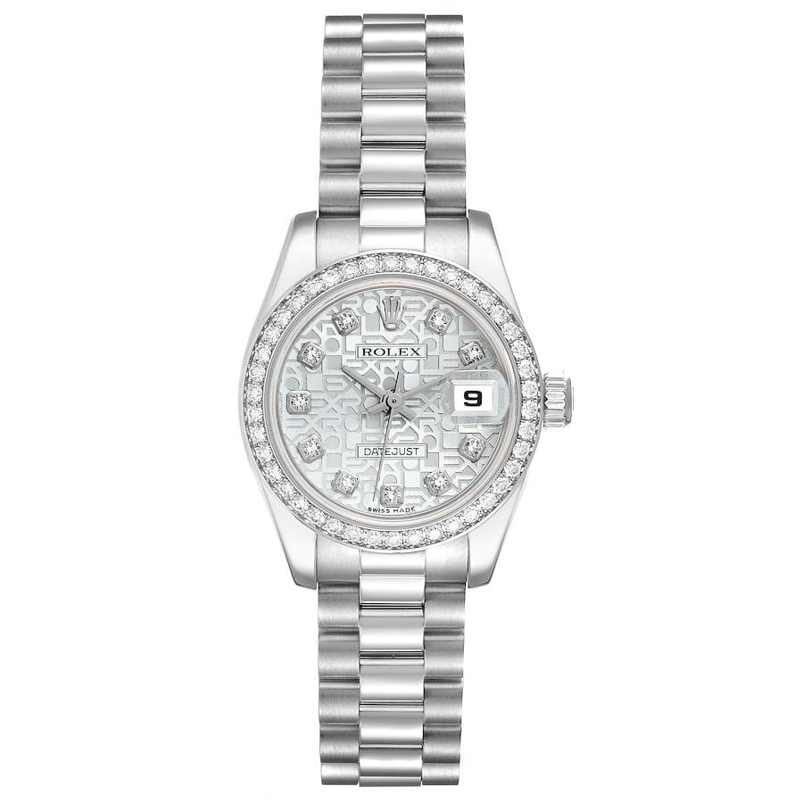 A silver Rolex Datejust wristwatch with a patterned face, diamond markers, and a metal link band.