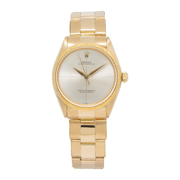 Gold Rolex Oyster Perpetual wristwatch, reference 1009, with a silver dial and gold hour markers, featuring a metal bracelet band.