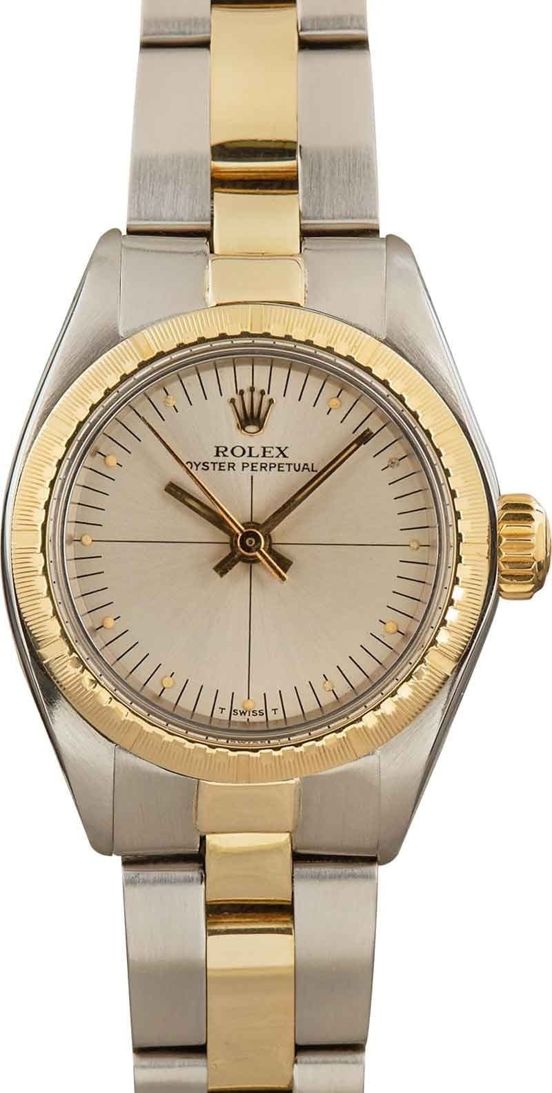 Gold and silver Rolex Oyster Perpetual 6724 wristwatch featuring a champagne dial and elegant two-tone bracelet.