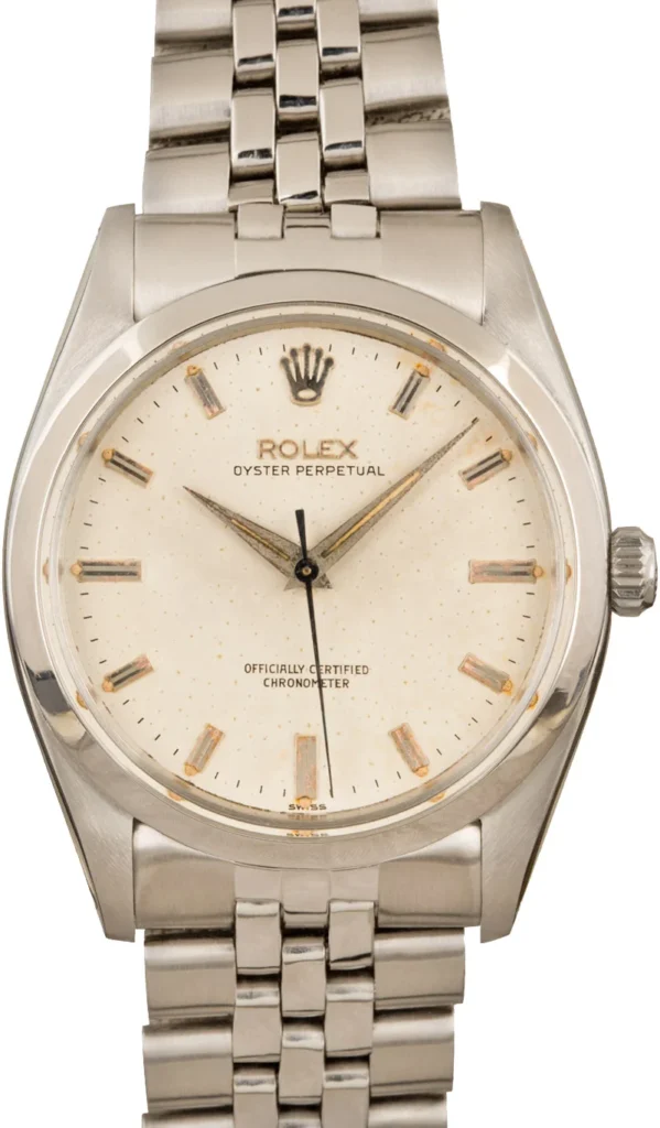 Silver Rolex Oyster Perpetual 6614 wristwatch with a white speckled dial and metal link bracelet.
