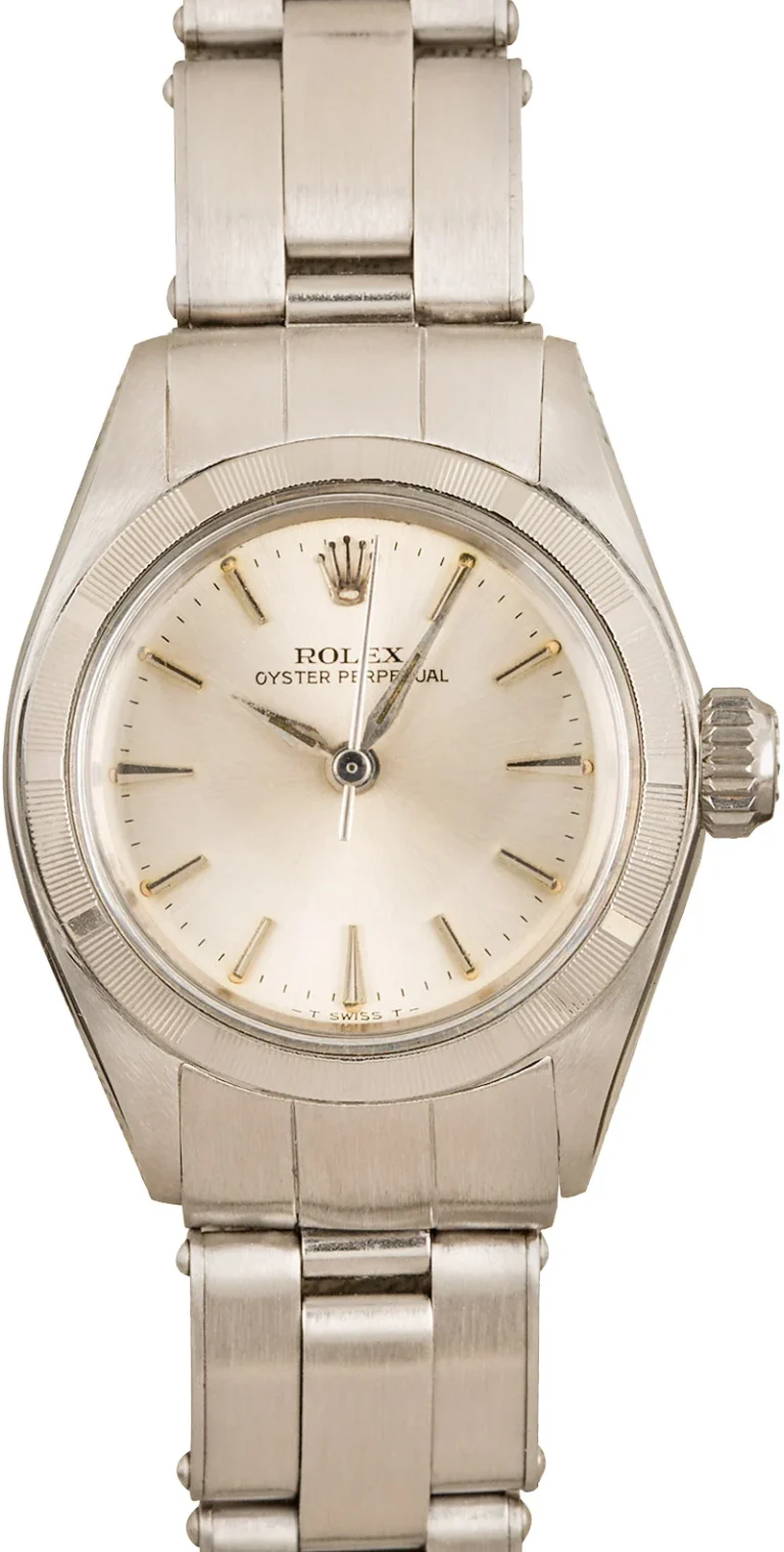 A silver Rolex Oyster Perpetual 6623 wristwatch with a metal band and a simple, light-colored dial.