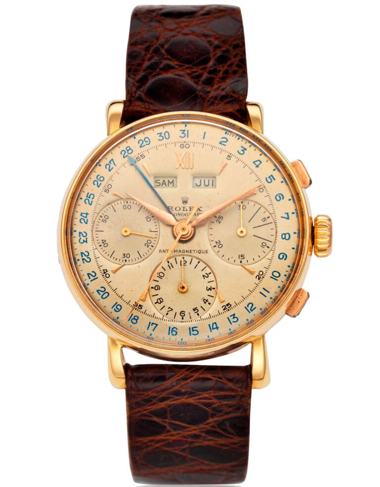 Vintage gold Rolex Chronograph 4768 wristwatch with three subdials, leather strap, and day-date indicators on the face.
