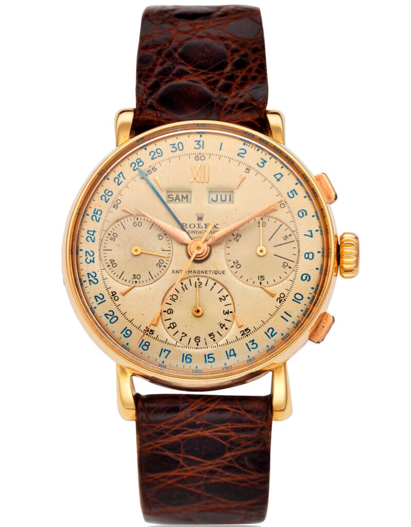 Vintage gold Rolex Chronograph 4768 wristwatch with three subdials, leather strap, and day-date indicators on the face.