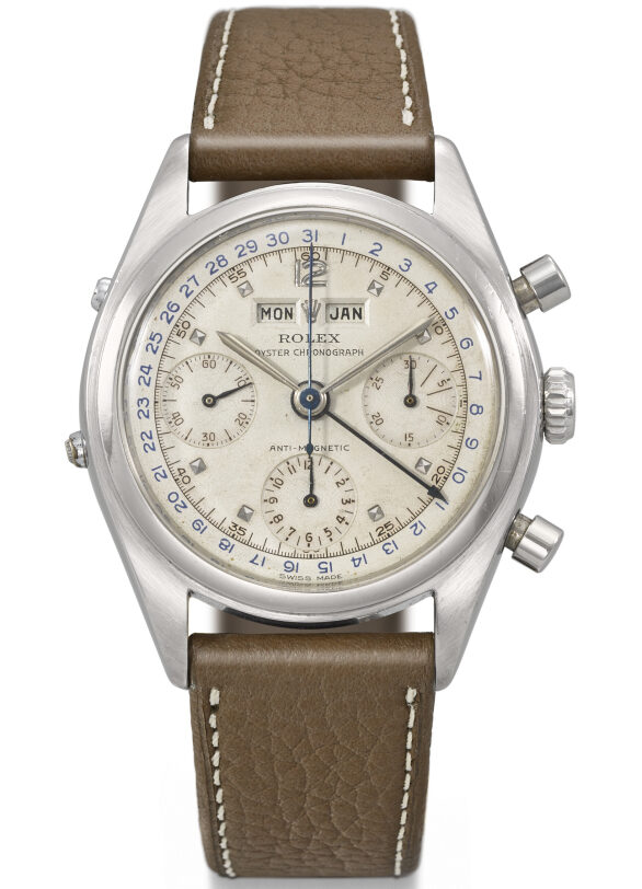 Vintage Rolex Chronograph 6036 watch with a brown leather strap and a detailed dial displaying multiple functions.