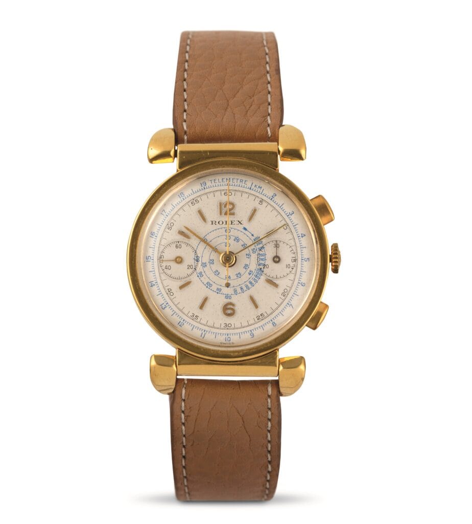 Gold vintage Rolex Chronograph wristwatch with a brown leather strap and detailed dial.