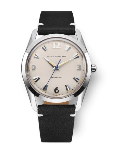 A silver Nivada Grenchen Antarctic 35001M15 wristwatch with a beige dial and black leather strap.
