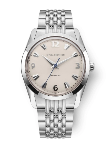 A silver Nivada Grenchen Antarctic 35004M04 wristwatch featuring a beige dial and sleek metal link bracelet.