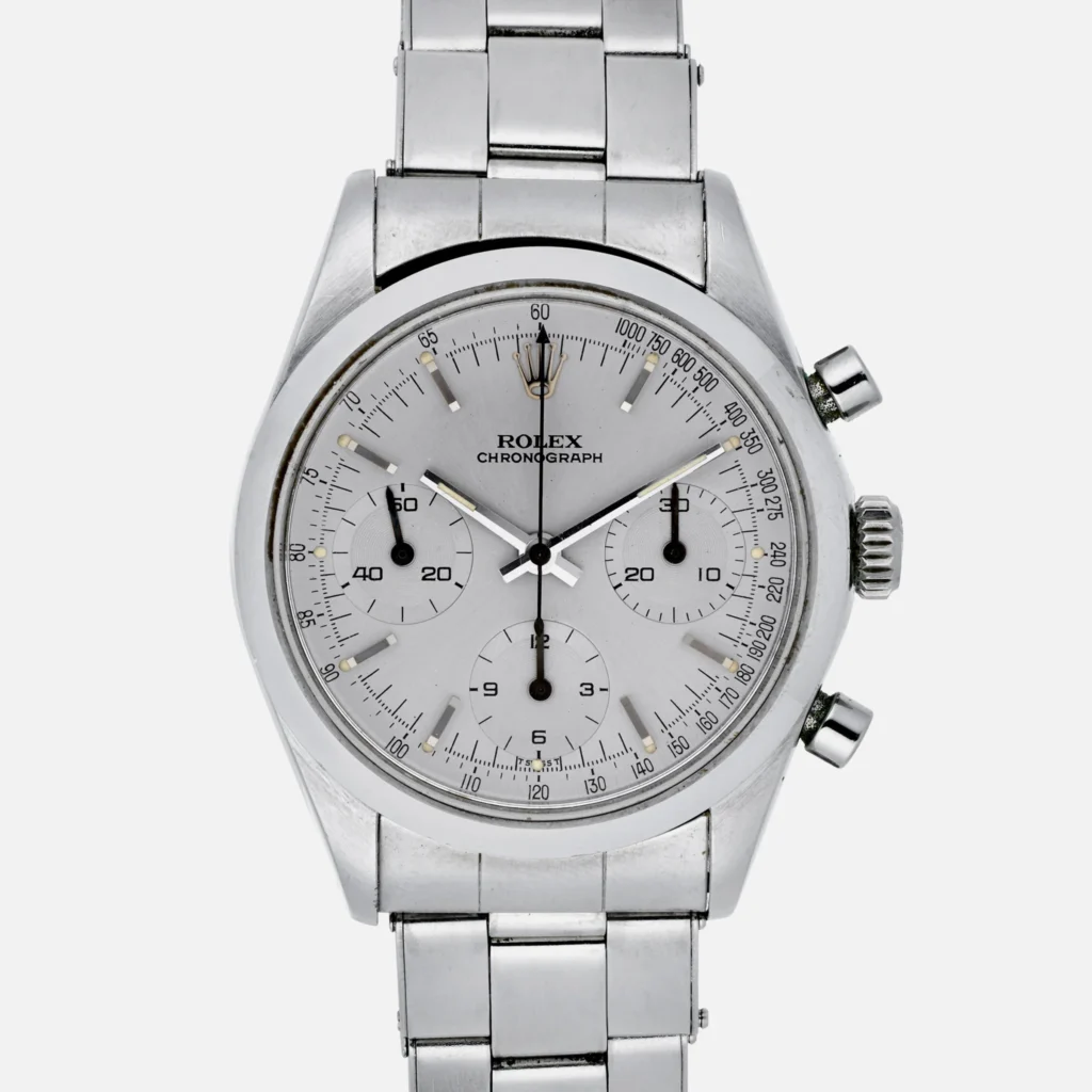 Silver Rolex chronograph 6238 watch with three subdials, metal bracelet, and two pushers on the right side.