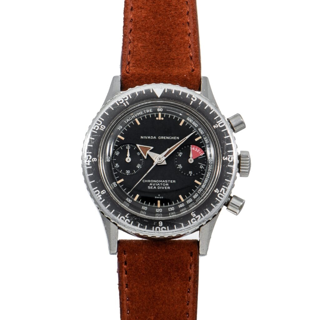 Vintage Nivada Grenchen Chronomaster Aviator Sea Diver 105-903006 watch featuring a black dial and brown leather strap.