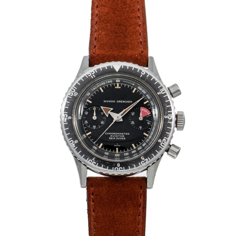Vintage Nivada Grenchen Chronomaster Aviator Sea Diver 105-903006 watch featuring a black dial and brown leather strap.