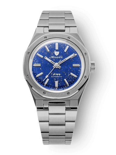 Nivada Grenchen F77 silver wristwatch with a blue speckled dial, silver hour markers, and a metal link band, model 68018A77, photographed on white.