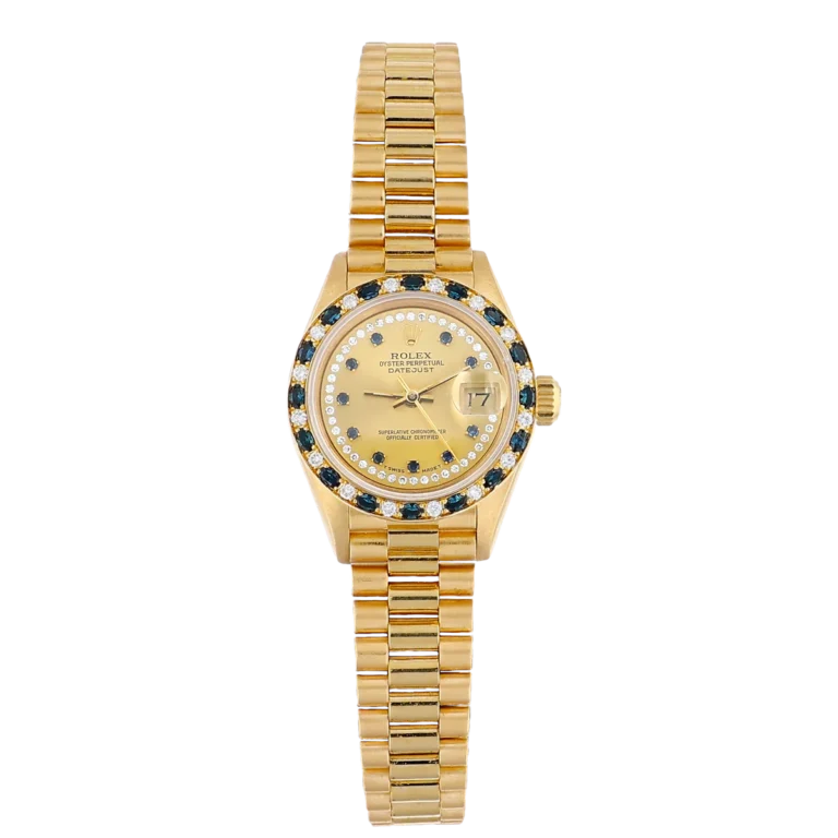Gold Rolex Datejust 69198 watch featuring a diamond and sapphire bezel, gold bracelet, and a champagne dial displaying the date.