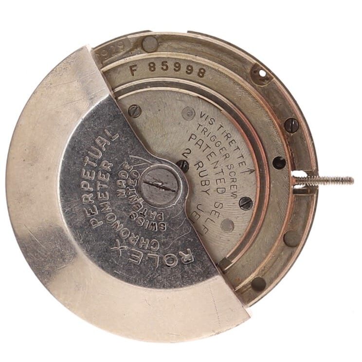 Close-up of a Rolex watch movement rotor engraved with Rolex Perpetual and technical details.