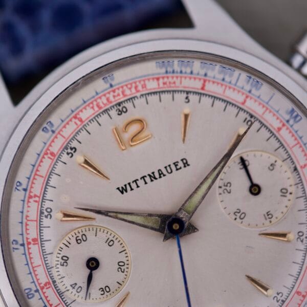 Close-up of a Wittnauer 3256 Chronograph Venus 188 watch face featuring gold markers, two subdials, and detailed hands and numbers.