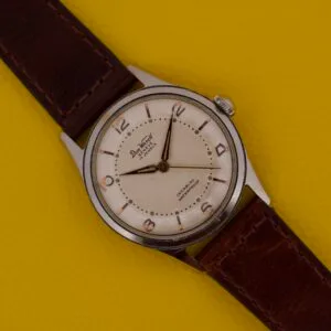 Dom Watch Geneve 17 Jewels Waffle Dial with a brown leather strap, showcased on a yellow textured background.