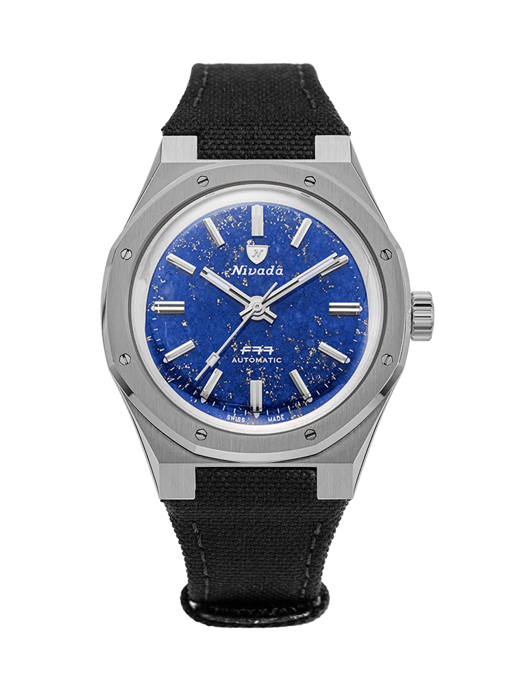 Silver wristwatch with a blue textured dial and black fabric strap on a transparent background, featuring the classic style of Nivada Grenchen. Model: 68017A77-BC,F77.