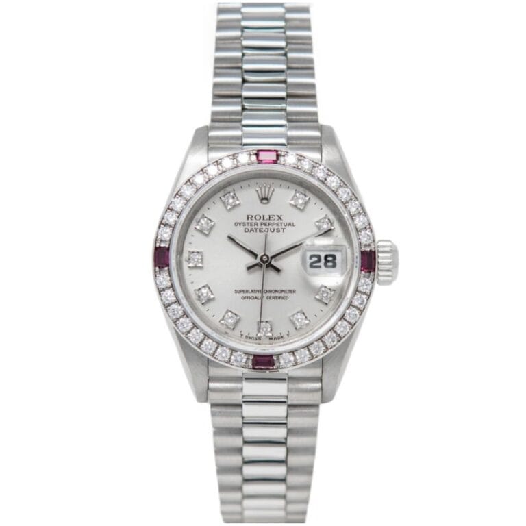 A silver Rolex Datejust 69069 watch with diamond markers, a diamond bezel, and a metal bracelet band.