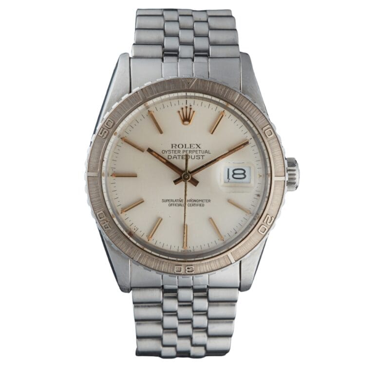 Silver Rolex Datejust 16250 watch featuring a white dial, metal band, and a date display at 3 o’clock.