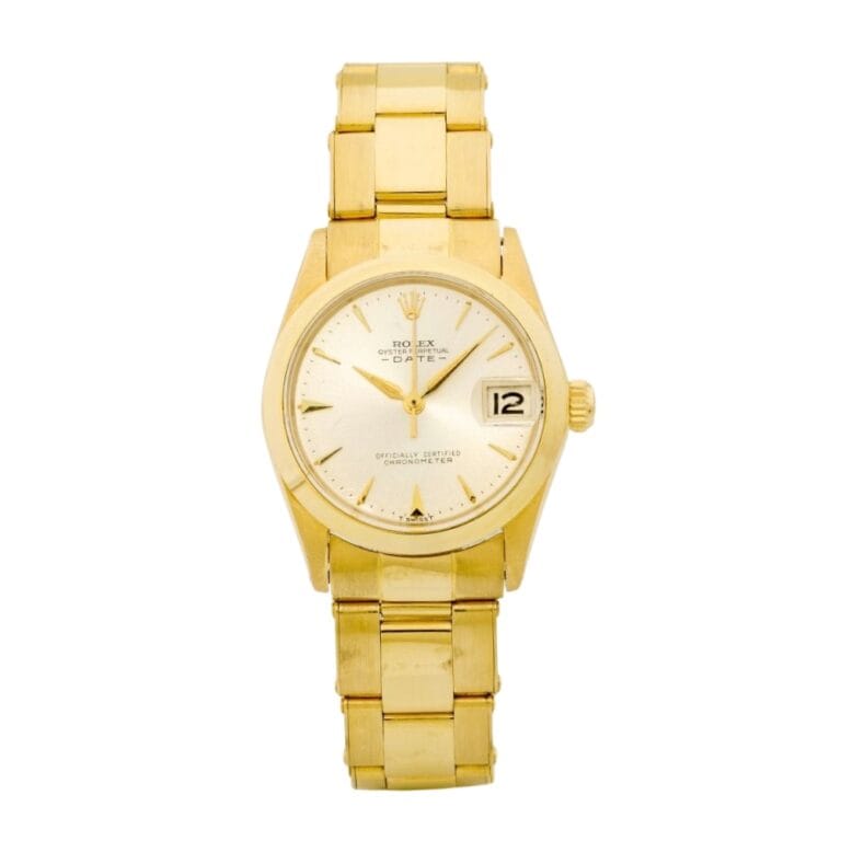 Gold Rolex Datejust wristwatch with a champagne dial and date display at 3 o’clock.