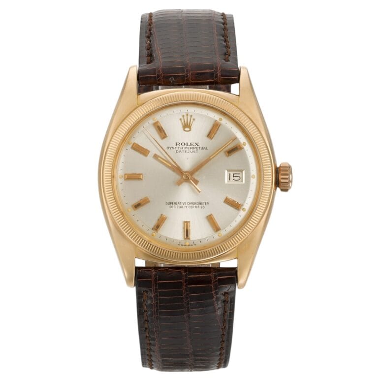 Gold Rolex Datejust 6105 wristwatch with a brown leather strap and date display, featuring a light-colored dial.