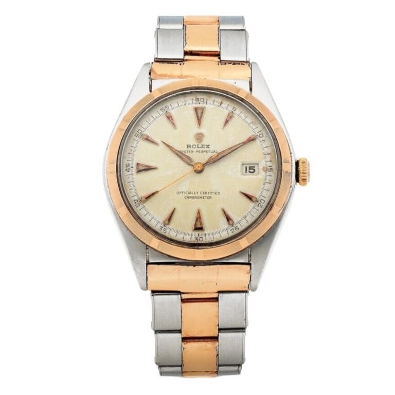 A vintage Rolex Datejust wristwatch with a two-tone metal band and a cream dial elegantly displaying the date.