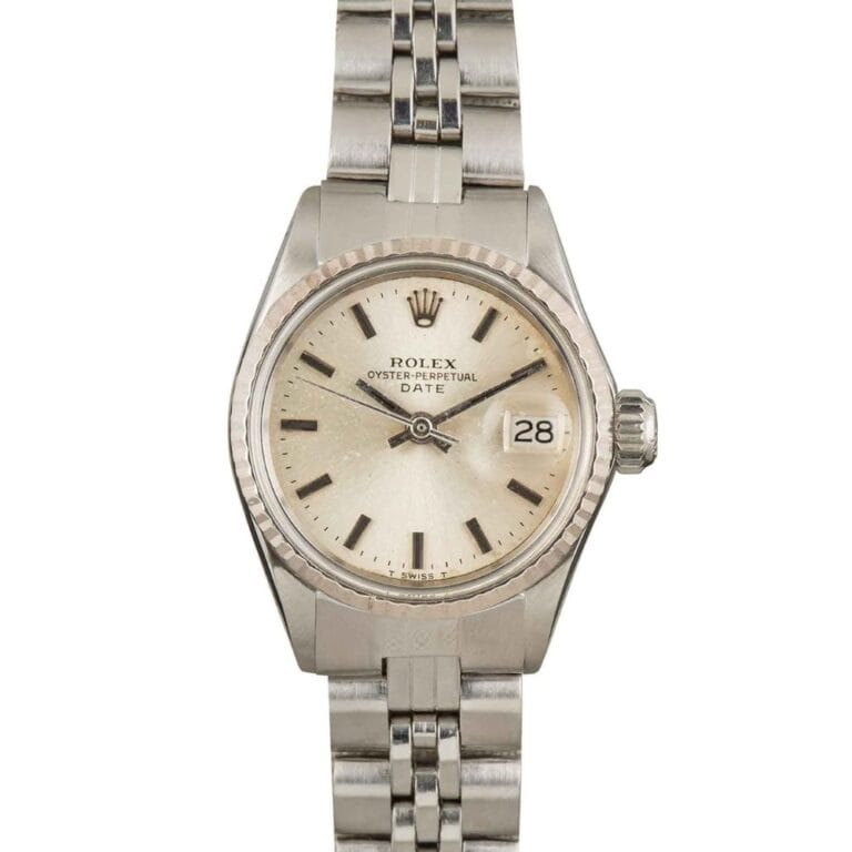 A silver Rolex Oyster Perpetual Datejust 6516 watch with a white dial and metal link bracelet.