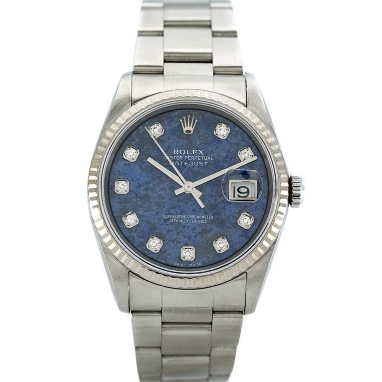 A silver Rolex Datejust 16244 watch with a blue dial, diamond hour markers, and a date window at 3 o’clock.